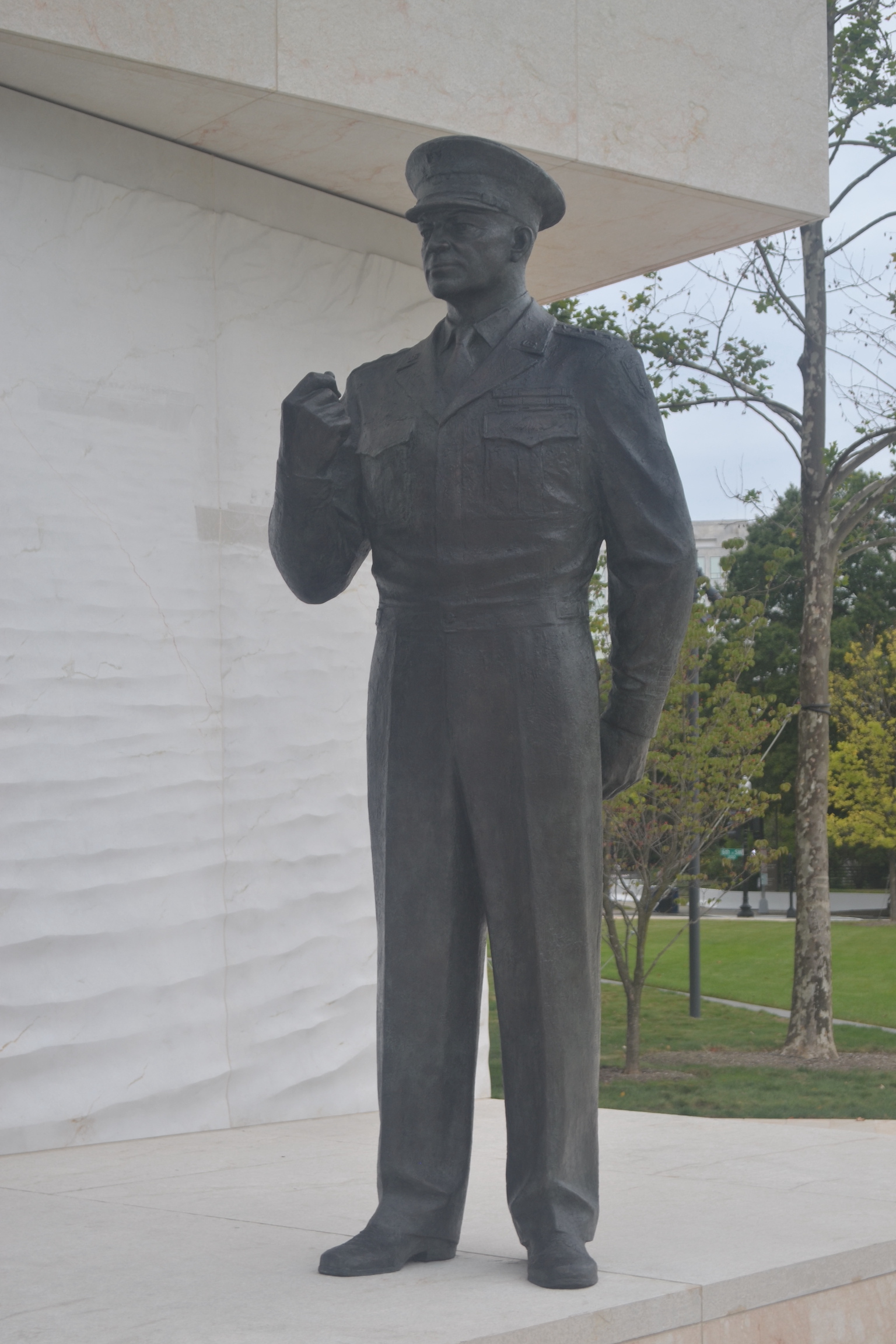 A bronze statue of a man in a military uniform.