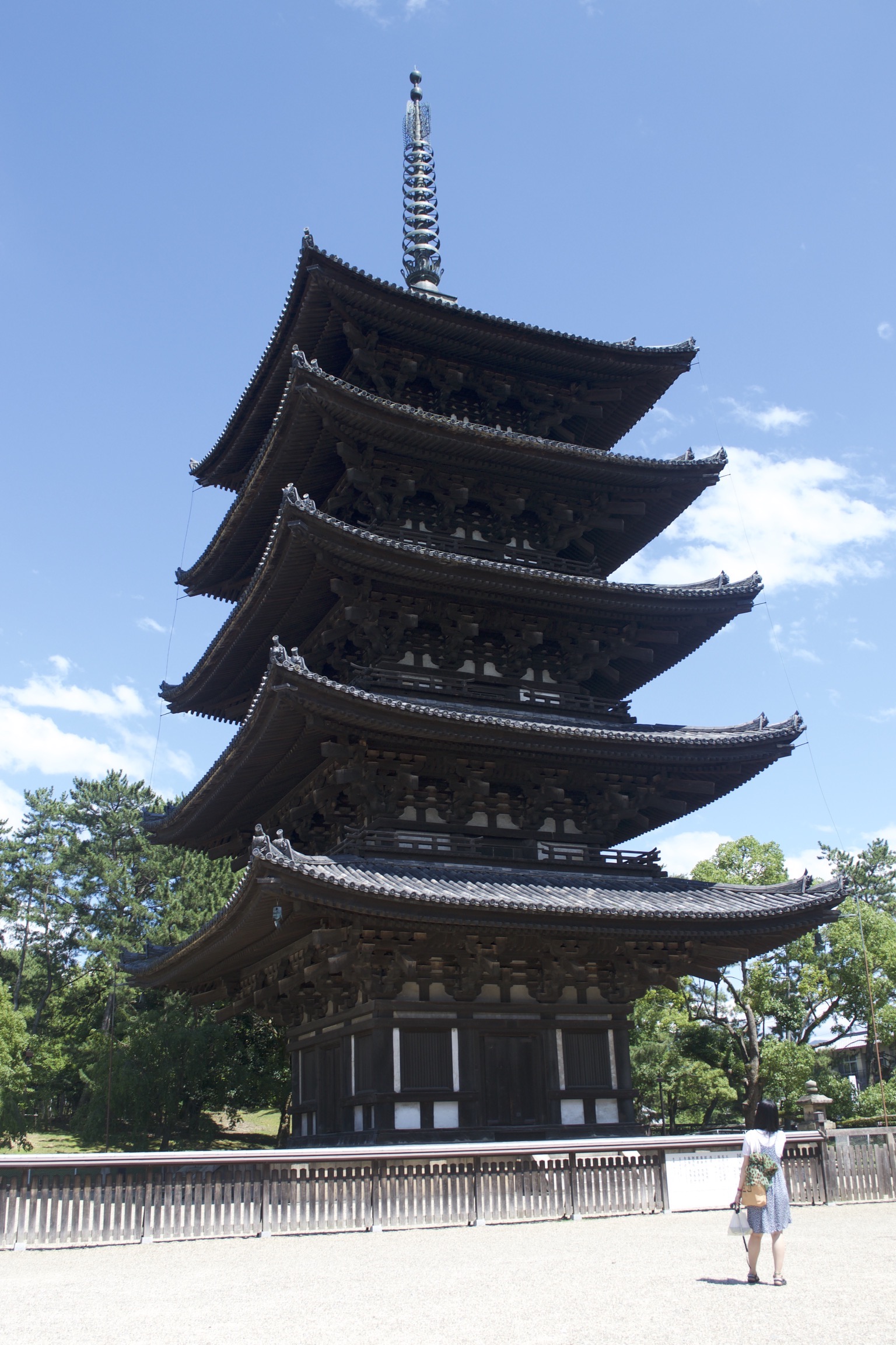 A five-story pagoda with a metal antenna.