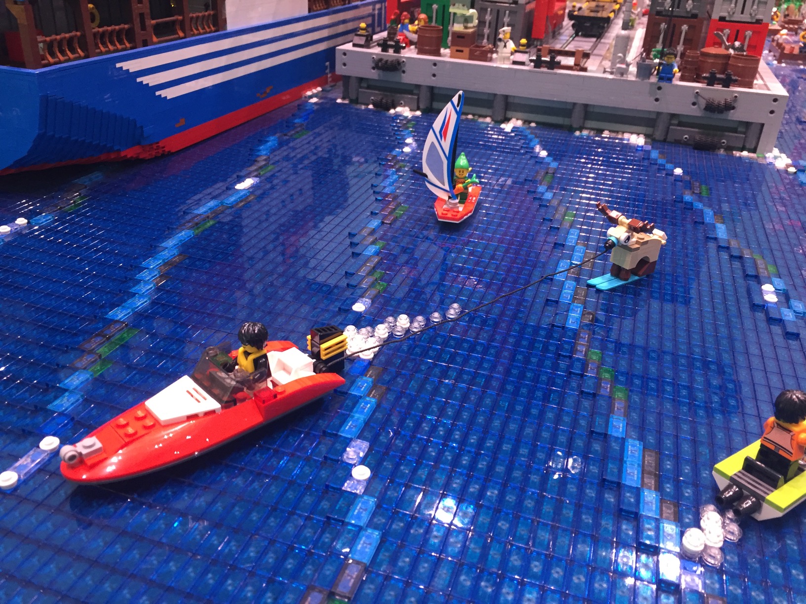 A LEGO reindeer water skiing.
